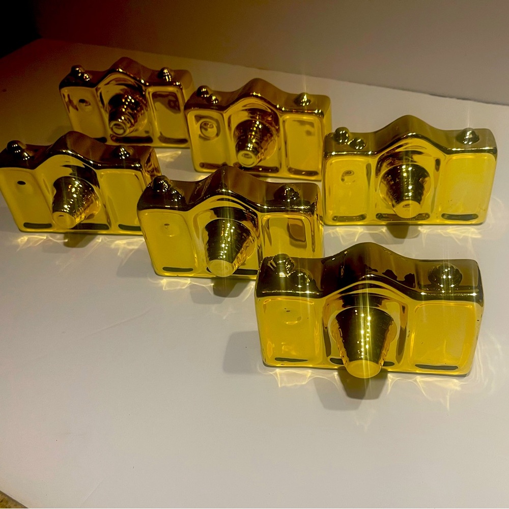 Ceramic gold camera figurine.